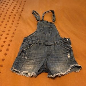Distressed denim overalls